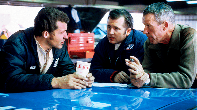 Feb 1, 1969; Riverside, CA, USA; FILE PHOTO; NASCAR Grand National Series driver Richard Petty (left), Lee Roy Yarbrough (center), and Lee Petty (right) talk in the garage at the 1969 Motor Trend 500 at Riverside International Speedway. Mandatory Credit: Darryl Norenberg-Imagn Images