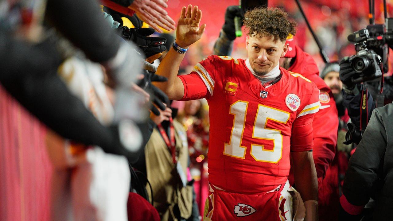 Kansas City Chiefs quarterback Patrick Mahomes (15) shakes hands with fans after defeating the Houston Texans in a 2025 AFC divisional round game at GEHA Field at Arrowhead Stadium.