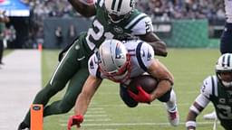 Nov 25, 2018; East Rutherford, NJ, USA; New England Patriots wide receiver Julian Edelman (11) scores a touchdown against New York Jets cornerback Morris Claiborne (21) during the third quarter at MetLife Stadium.