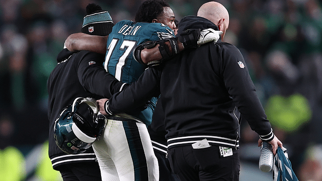 Philadelphia Eagles linebacker Nakobe Dean (17) is helped off the field against the Green Bay Packers during the first half in an NFC wild card game at Lincoln Financial Field.