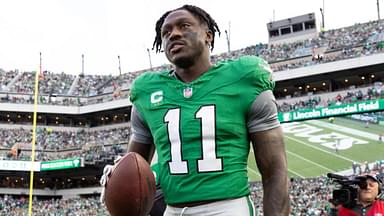 Dec 29, 2024; Philadelphia, Pennsylvania, USA; Philadelphia Eagles wide receiver A.J. Brown (11) carries his touchdown ball back to quarterback Tanner McKee (not pictured) during the third quarter against the Dallas Cowboys at Lincoln Financial Field.