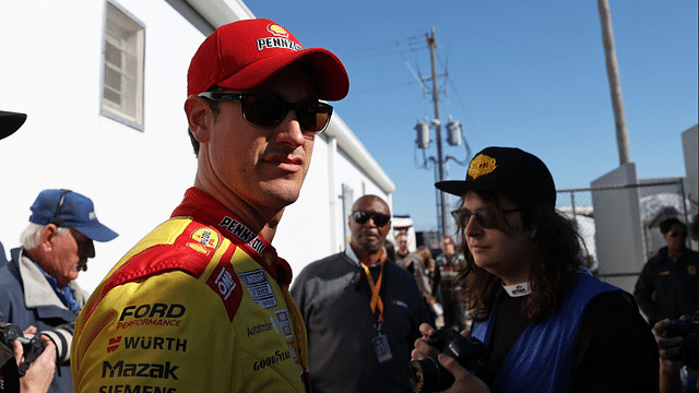 Feb 19, 2024; Daytona Beach, Florida, USA; NASCAR Cup Series driver Joey Logano (22) walks to the drivers meeting before the Daytona 500 at Daytona International Speedway. Mandatory Credit: Peter Casey-Imagn Images