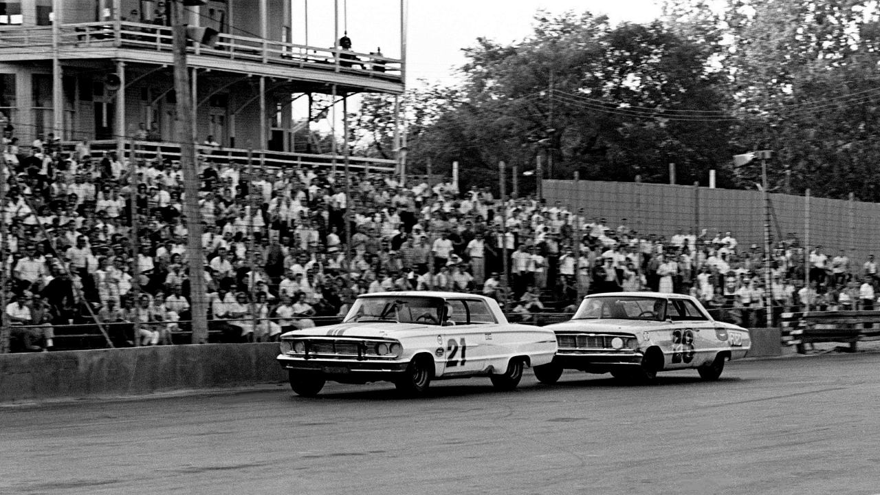 Driver Nelson Stacy in on the bumper of another driver in the ARCA 300-lap model race at the Fairgrounds Speedway on May 17, 1964. Stacy went on to finishes second behind winner Jack Bowsher before a crowd of 6,000.