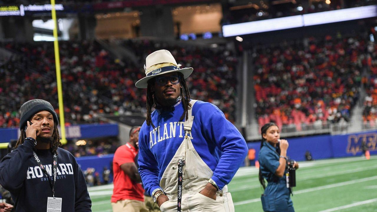 Former Auburn and NFL star Cam Newton stands on the sidelines during the Cricket Celebration Bowl game between Florida A&M University and Howard University at Mercedes-Benz Stadium in Atlanta on Dec. 16, 2023.