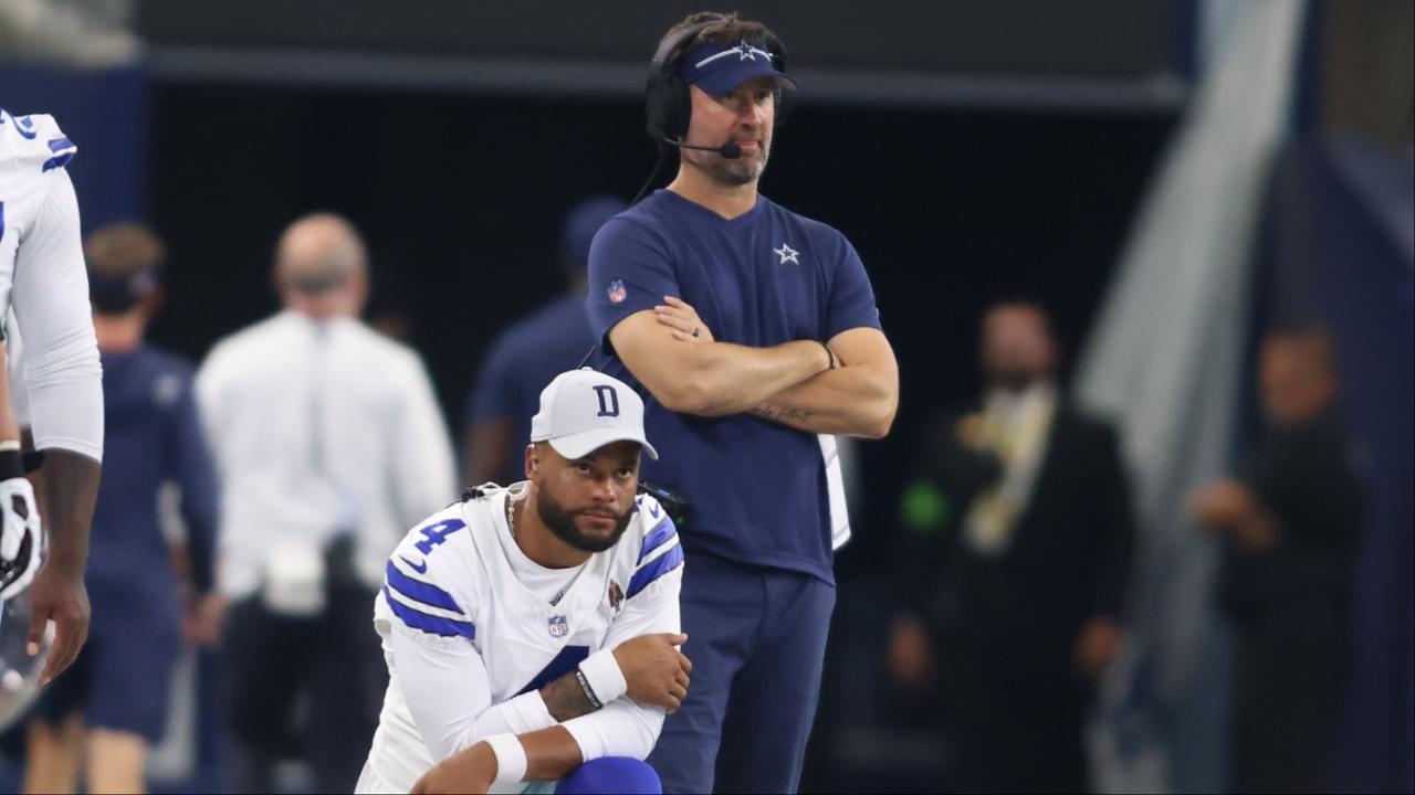 Dallas Cowboys quarterback Dak Prescott (4) and offensive coordinator Brian Schottenheimer watch a play in the game against the Jacksonville Jaguars at AT&T Stadium.