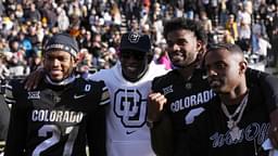 Colorado Buffaloes safety Shilo Sanders (21) and head coach Deion Sanders and quarterback Shedeur Sanders (2) and social media producer Deion Sanders Jr. following the win against the Oklahoma State Cowboys at Folsom Field.