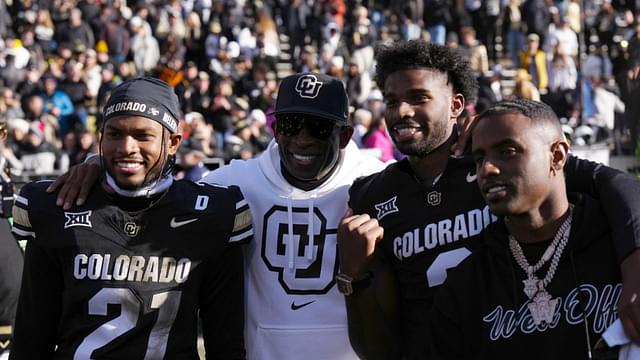 Colorado Buffaloes safety Shilo Sanders (21) and head coach Deion Sanders and quarterback Shedeur Sanders (2) and social media producer Deion Sanders Jr. following the win against the Oklahoma State Cowboys at Folsom Field.