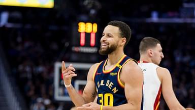 Golden State Warriors guard Stephen Curry (30) reacts during the third quarter against the Miami Heat at Chase Center.