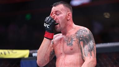 Colby Covington (red gloves) fights Joaquin Buckley (blue gloves) at Amalie Arena.