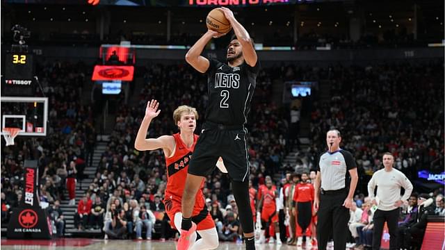 Brooklyn Nets forward Cam Johnson (2) shoots the ball over Toronto Raptors guard Gradey Dick (1) in the first half at Scotiabank Arena