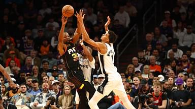 Phoenix Suns forward Kevin Durant (35) against San Antonio Spurs center Victor Wembanyama (1) in the first half of an NBA Cup game at Footprint Center