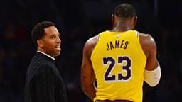 Los Angeles Lakers forward LeBron James (23) speaks with businessman Maverick Carter (left) during a stoppage in play in the second half at Staples Center.