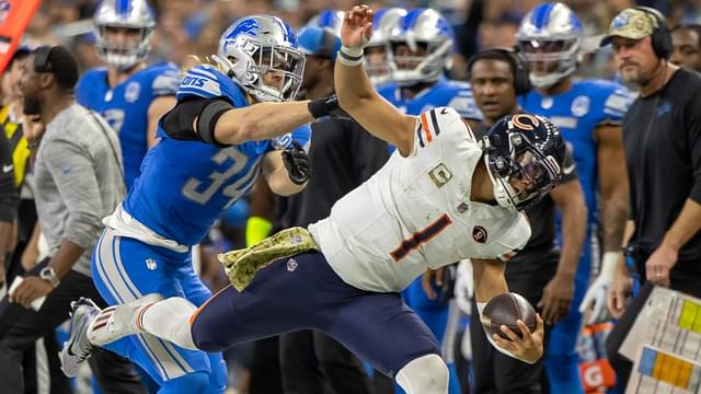 Nov 19, 2023; Detroit, Michigan, USA; Chicago Bears quarterback Justin Fields (1) runs with the ball and is pushed out of bounds by Detroit Lions linebacker Alex Anzalone (34) during the second half at Ford Field.