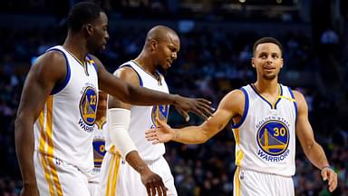 Golden State Warriors guard Stephen Curry (30) and Golden State Warriors forward Draymond Green (23) celebrate with Golden State Warriors forward David West (3) during the second half of the Golden State Warriors 104-88 win over the Boston Celtics at TD Garden