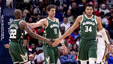 Milwaukee Bucks forward Giannis Antetokounmpo (34) slaps hands with forward Khris Middleton (22) and center Brook Lopez (11) after a play against the New Orleans Pelicans during the second half at Smoothie King Center.