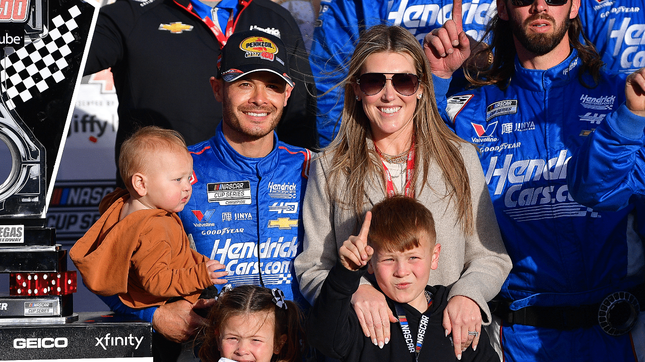 NASCAR Cup Series driver Kyle Larson (5) poses for photos with his family and crew following his victory of the Pennzoil 400 at Las Vegas Motor Speedway.