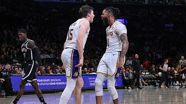 Los Angeles Lakers guard Austin Reaves (15) and guard D'Angelo Russell (1) react after a basket during the second half against the Brooklyn Nets at Barclays Center.