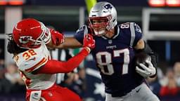 Oct 14, 2018; Foxborough, MA, USA; New England Patriots tight end Rob Gronkowski (87) makes a catch and stiff arms Kansas City Chiefs free safety Ron Parker (38) in the second half at Gillette Stadium. The Patriots defeated Kansas City 43-40.