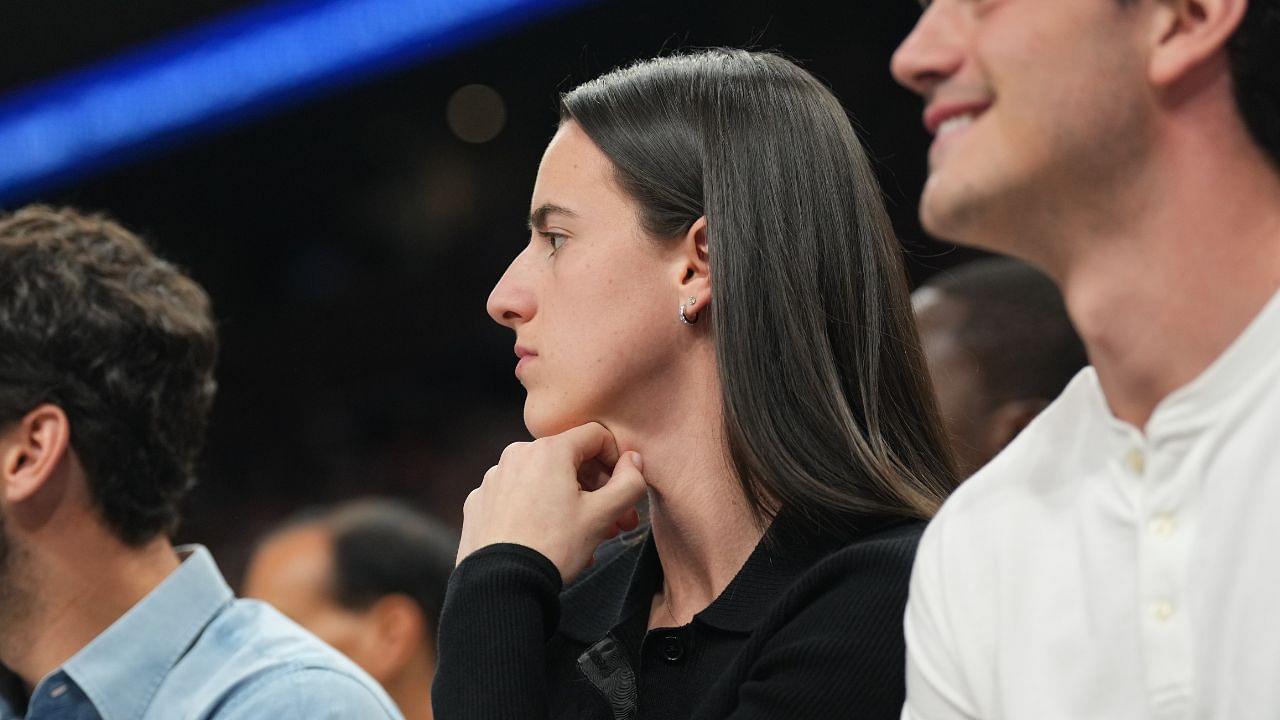 Indiana Fever player Caitlin Clark attends the game between the Phoenix Suns and the Golden State Warriors during the first half at Footprint Center.