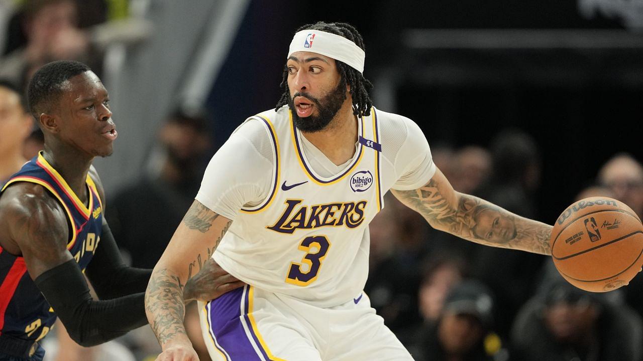 Los Angeles Lakers forward Anthony Davis (3) dribbles against Golden State Warriors guard Dennis Schroder (left) during the fourth quarter at Chase Center.