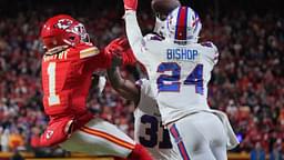 Kansas City Chiefs wide receiver Xavier Worthy (1) makes a catch against Buffalo Bills safety Cole Bishop (24) during the first half in the AFC Championship game at GEHA Field at Arrowhead Stadium.