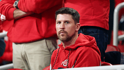 Denny Hamlin looks on before the CFP National Championship college football game at Mercedes-Benz Stadium.