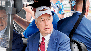 Roger Penske drives his golf cart along pit lane Sunday, May 26, 2024, ahead of the 108th running of the Indianapolis 500 at Indianapolis Motor Speedway.