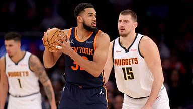 New York Knicks center Karl-Anthony Towns (32) controls the ball against Denver Nuggets center Nikola Jokic (15) during the third quarter at Madison Square Garden