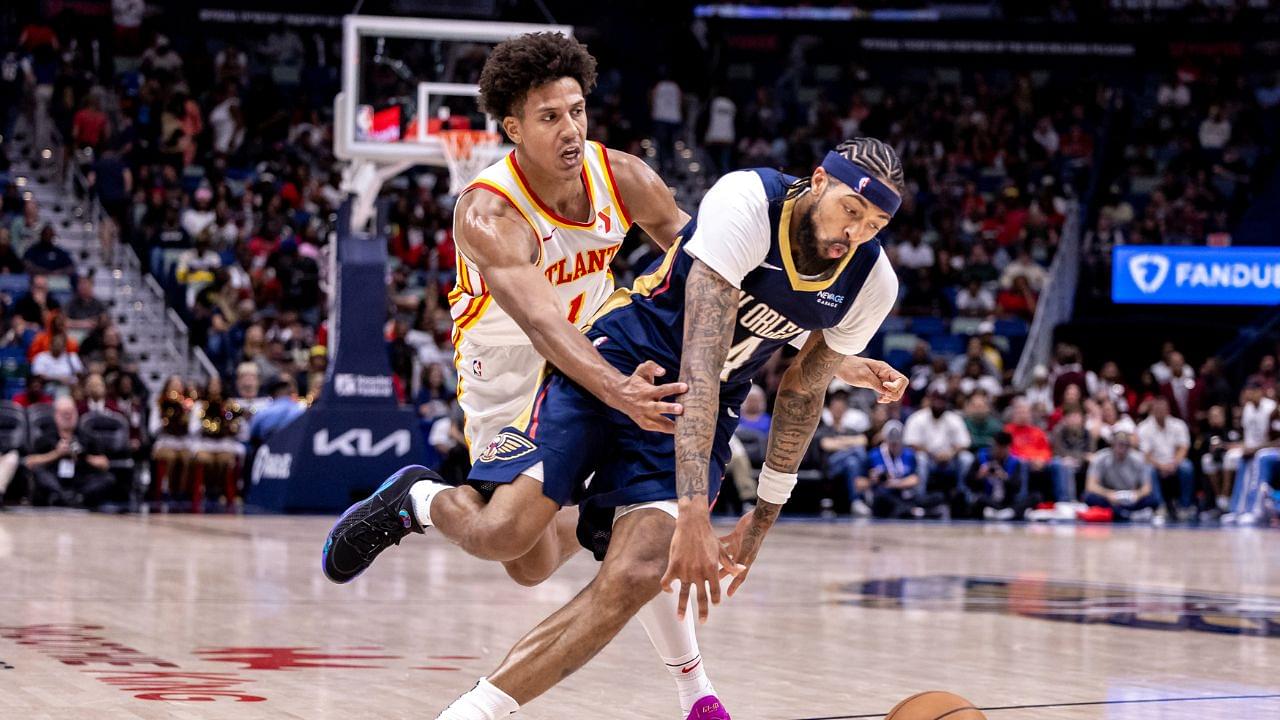 New Orleans Pelicans forward Brandon Ingram (14) dribbles around Atlanta Hawks forward Jalen Johnson (1) during the second half at Smoothie King Center