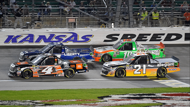 May 6, 2016; Kansas City, KS, USA; NASCAR Camping World Truck Series drivers Christopher Bell (4) and William Byron (9) race ahead of Johnny Sauter (21) and Daniel Hemric (19) during the Toyota Tundra 250 at Kansas Speedway. Mandatory Credit: Jasen Vinlove-Imagn Images