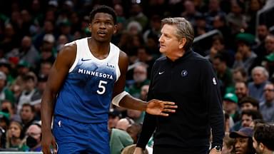 Minnesota Timberwolves head coach Chris Finch talks with guard Anthony Edwards (5) during the second quarter against the Boston Celtics at TD Garden.