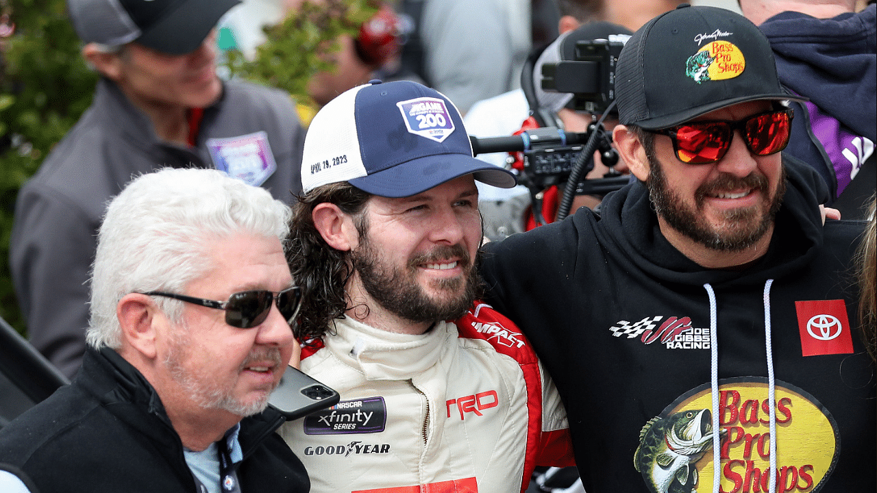 NASCAR Xfinity Series driver Ryan Truex (second from left) celebrates in victory lane with brother NASCAR Cup Series driver Martin Truex Jr (right) and his father Martin Truex Sr (left) after winning the A-GAME 200 at Dover Motor Speedway. Mandatory Credit: Matthew OHaren-Imagn Images