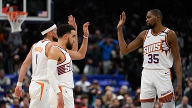 Phoenix Suns guard Tyus Jones (21), guard Devin Booker (1), and forward Kevin Durant (35) celebrate during the fourth quarter against the Washington Wizards at Capital One Arena.