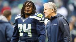 Seattle Seahawks head coach Pete Carroll talks with Seattle Seahawks running back Marshawn Lynch (24) during pre game warmups against the Arizona Cardinals at CenturyLink Field.