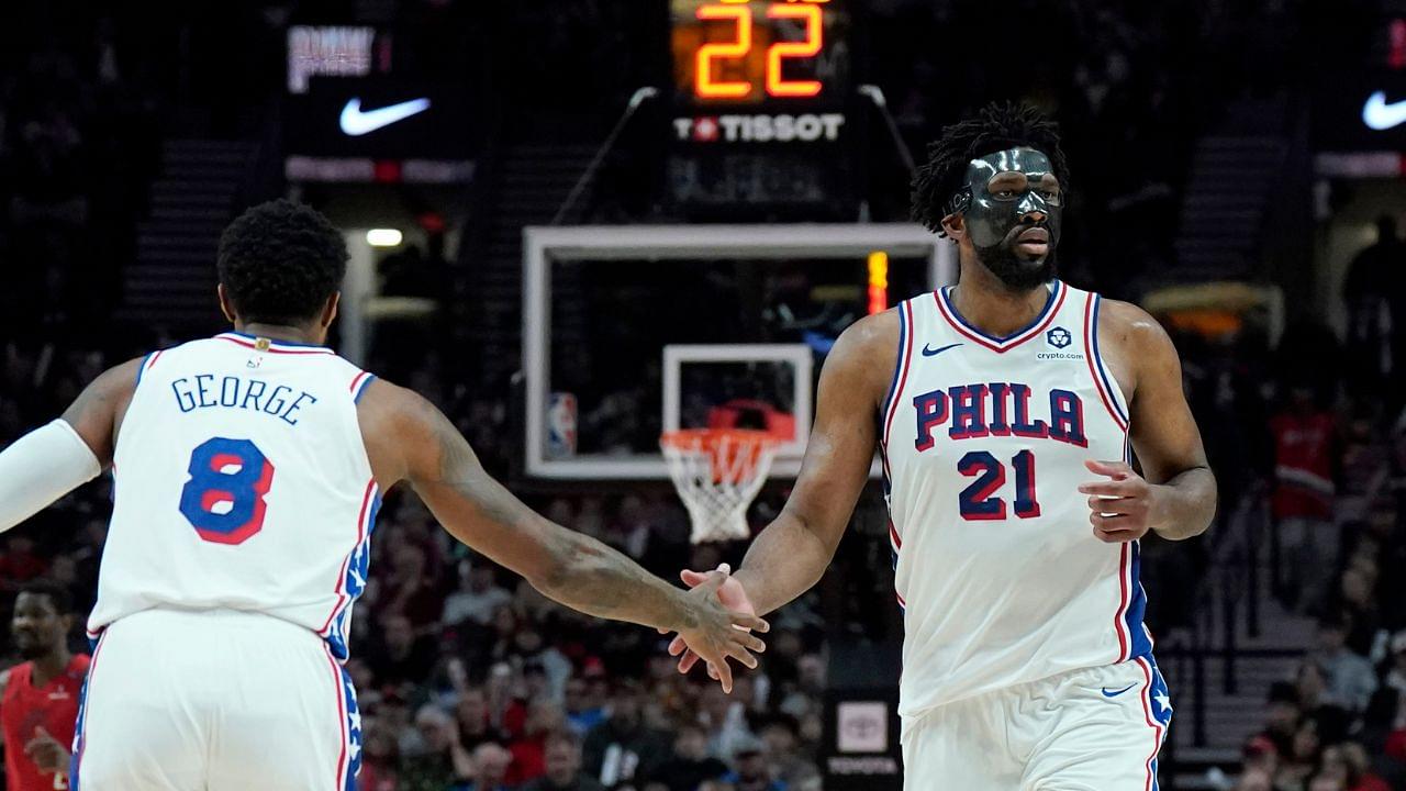 Philadelphia 76ers center Joel Embiid (21) and forward Paul George (8) high five during the second half against the Portland Trail Blazers at Moda Center.