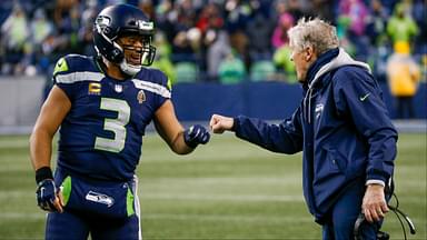 Seattle Seahawks quarterback Russell Wilson (3) bumps fists with head coach Pete Carroll during the fourth quarter two-minute warning against the Detroit Lions at Lumen Field.