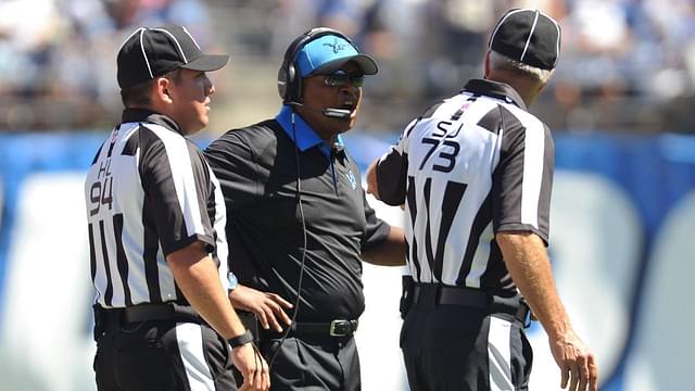 San Diego, CA, USA; Detroit Lions head coach Jim Caldwell (center) talks to side judge Joe Larrew (73) and head linesman Hugo Cruz (94) during the first quarter of the game against the San Diego Chargers at Qualcomm Stadium. San Diego won 33-28.