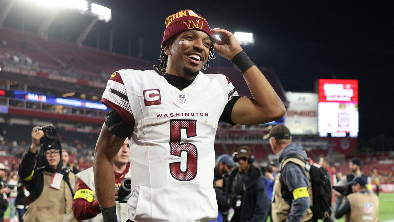 Washington Commanders quarterback Jayden Daniels (5) celebrates after winning a NFC wild card playoff against the Tampa Bay Buccaneers at Raymond James Stadium.