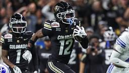 Dec 28, 2024; San Antonio, TX, USA; Colorado Buffaloes wide receiver Travis Hunter (12) runs with the ball during the second quarter against the Brigham Young Cougars at Alamodome.