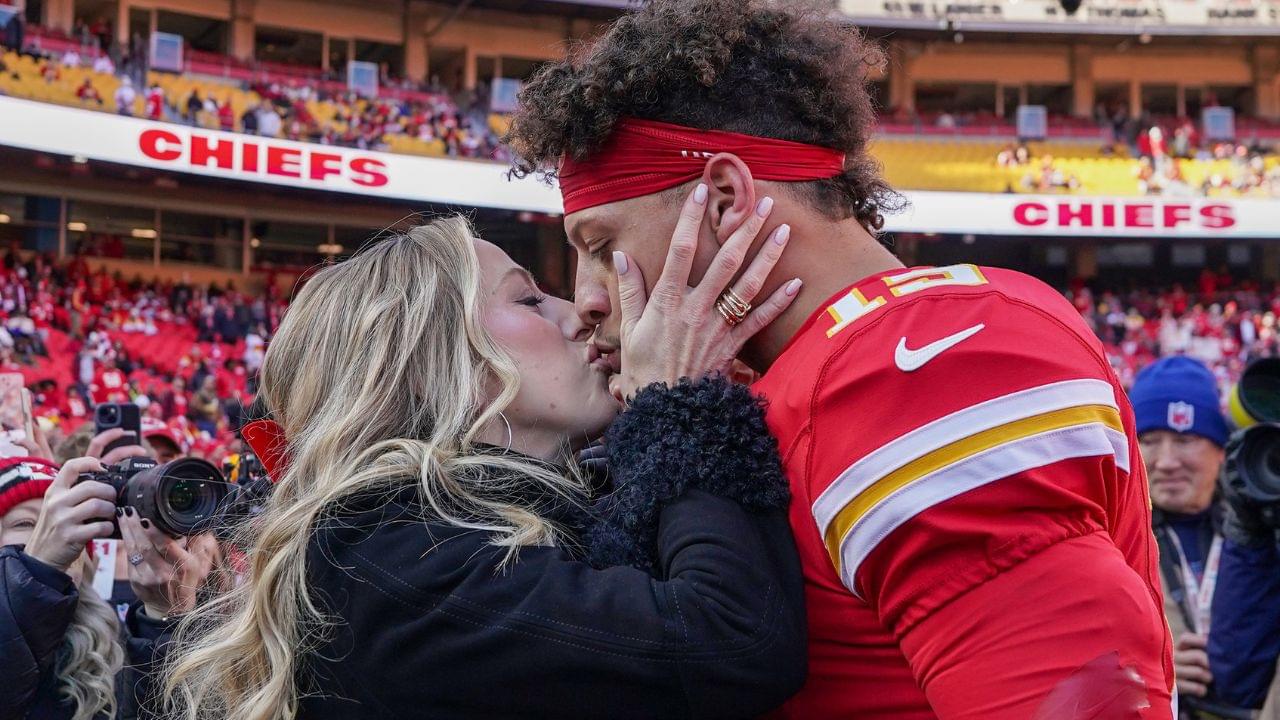 Kansas City Chiefs quarterback Patrick Mahomes (15) kisses his wife Brittany prior to a game against the Las Vegas Raiders at GEHA Field at Arrowhead Stadium.