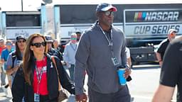 Michael Jordan and his wife Yvette Jordan walk through the garage area at Daytona International Speedway.