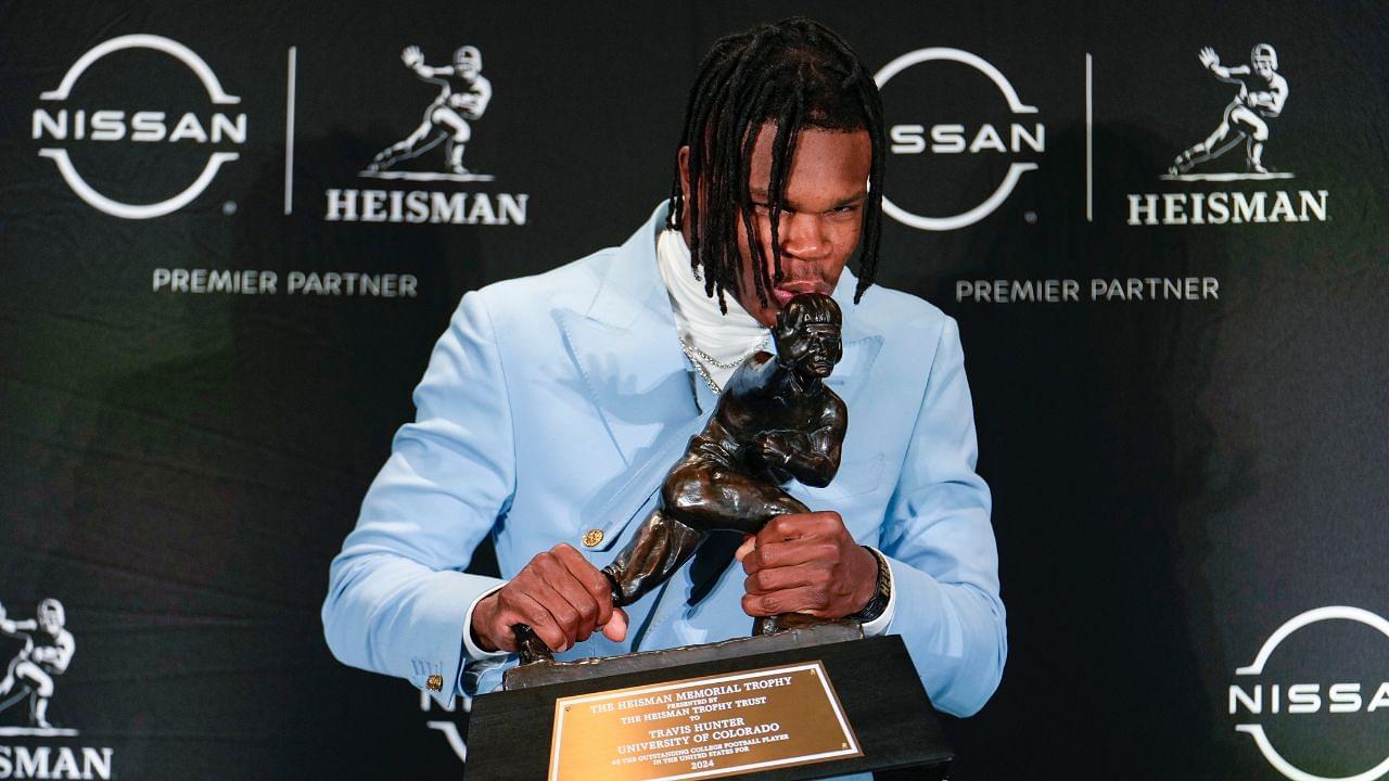 Colorado Buffaloes wide receiver/cornerback Travis Hunter poses for a photo after winning the Heisman Trophy award during the 2024 Heisman Trophy Presentation.