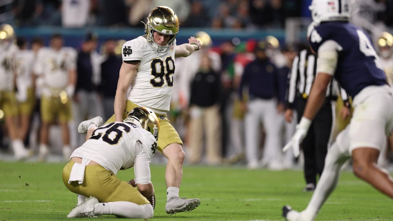 Jan 9, 2025; Miami, FL, USA; Notre Dame Fighting Irish place kicker Mitch Jeter (98) kicks the ball in the second half against the Penn State Nittany Lions at Hard Rock Stadium.