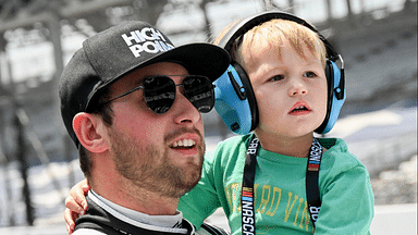 NASCAR Cup Series driver Chase Briscoe (14) holds his son, Brooks, during qualifying for the Brickyard 400, Saturday, July 20, 2024, at Indianapolis Motor Speedway.