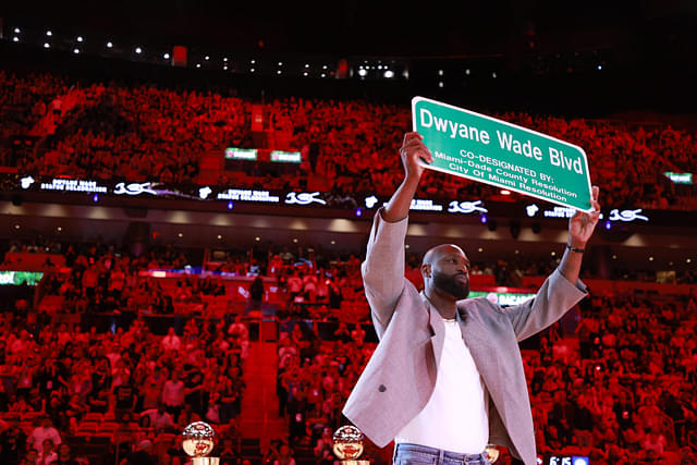 Former Miami Heat guard Dwyane Wade is honored with 'Dwayne Wade Blvd' at halftime during a game against the Detroit Pistons at Kaseya Center.