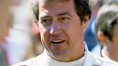 Driver Harry Gant takes a break during qualifying trials for the Nashville Pepsi 420 NASCAR Grand National race at Nashville International Raceway on July 13, 1984.