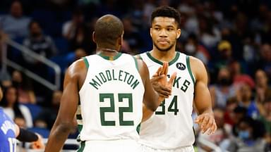 Milwaukee Bucks forward Khris Middleton (22) and forward Giannis Antetokounmpo (34) celebrate a three point shot in the second half against the Orlando Magic at Amway Center.