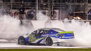 NASCAR Cup Series driver Daniel Suarez (99) celebrates after winning the Ambetter Health 400 at Atlanta Motor Speedway.