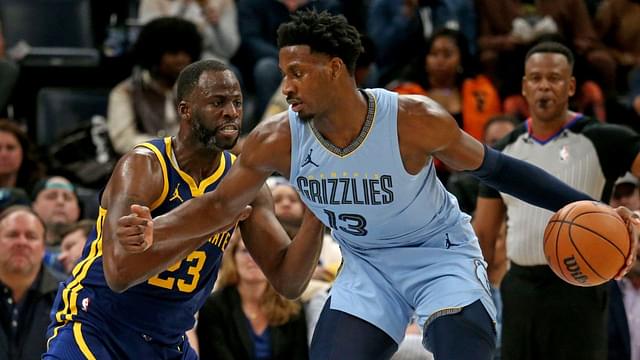 Memphis Grizzlies forward-center Jaren Jackson Jr. (13) dribbles as Golden State Warriors forward Draymond Green (23) defends during the second half at FedExForum.