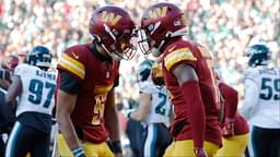 Washington Commanders quarterback Jayden Daniels (5) celebrates with Commanders wide receiver Terry McLaurin (17) after connecting on a touchdown pass against the Philadelphia Eagles during the second quarter at Northwest Stadium